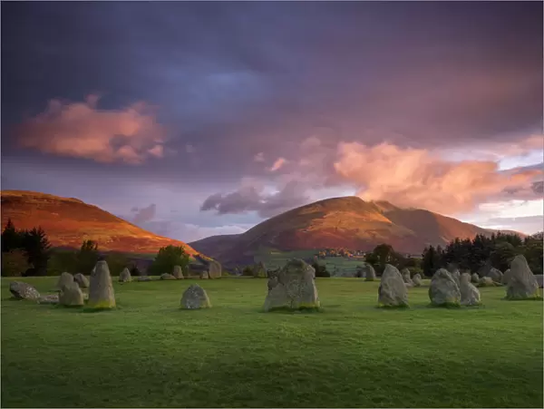 Castlerigg Stone Circle in autumn at sunrise with Blencathra bathed in dramatic dawn light