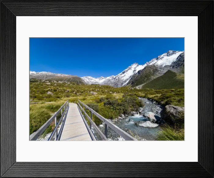 Framed Print : A hiking trail crosses wooden bridge over a creak high up in the mountains, South Island Framed Print : A hiking trail crosses wooden bridge over a creak high up in the mountains, South Island