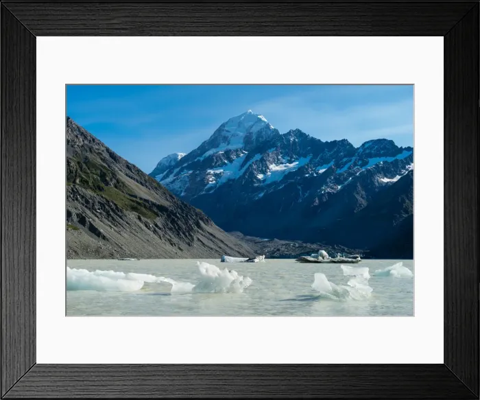 Framed Print : Icebergs float in a cold lake with a large snow covered mountain, South Island, New Zealand Framed Print : Icebergs float in a cold lake with a large snow covered mountain, South Island, New Zealand