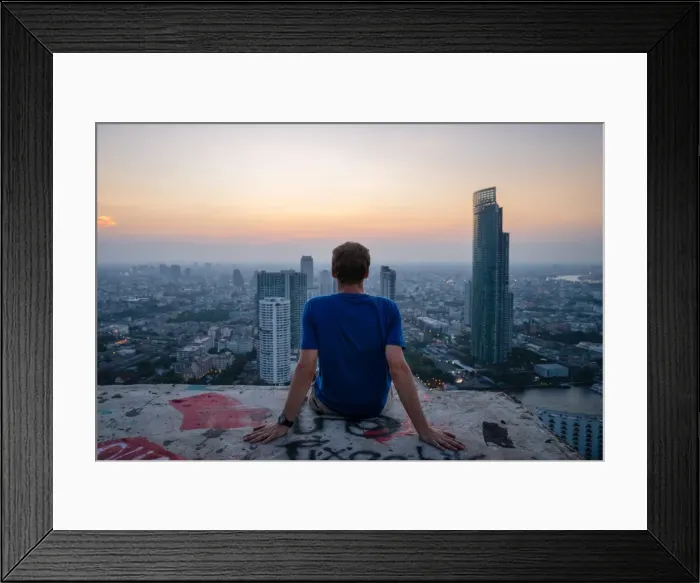 Framed Print : A single man watching sun set over city skyline at dusk, Bangkok, Thailand, Southeast Asia Framed Print : A single man watching sun set over city skyline at dusk, Bangkok, Thailand, Southeast Asia