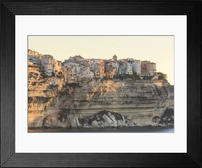 Framed Print : Old citadel townhouses and church at dawn, in early morning light, seen from the sea Framed Print : Old citadel townhouses and church at dawn, in early morning light, seen from the sea