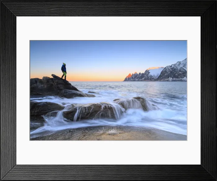 Framed Print : Hiker admires the waves of the icy sea crashing on the rocky cliffs at dawn, Tungeneset Framed Print : Hiker admires the waves of the icy sea crashing on the rocky cliffs at dawn, Tungeneset