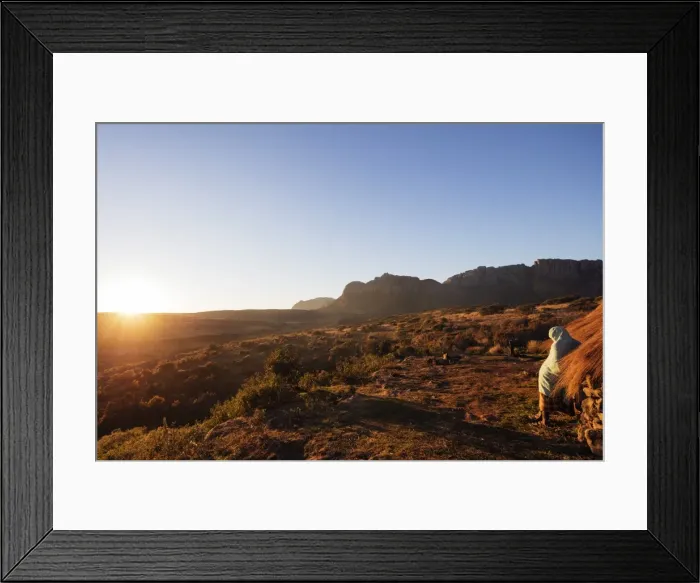 Framed Print : A local man warming up in the morning sun, Andringitra National Park, Ambalavao, central area Framed Print : A local man warming up in the morning sun, Andringitra National Park, Ambalavao, central area