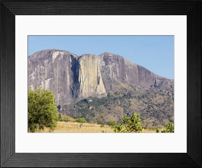 Framed Print : Chameleon Peak with local women on a trail, Tsaranoro Valley, Ambalavao, central area Framed Print : Chameleon Peak with local women on a trail, Tsaranoro Valley, Ambalavao, central area