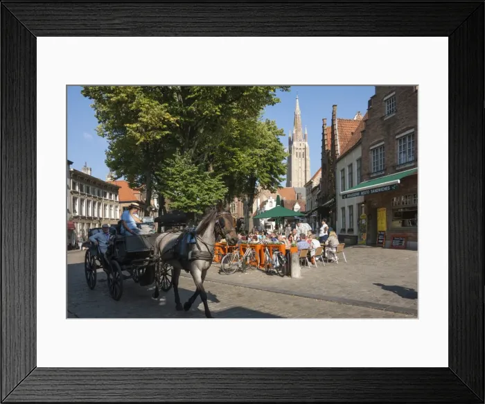 Framed Print : Square with cafe, horse and carriage, and spire of Church of Our Lady, Bruges, Belgium
