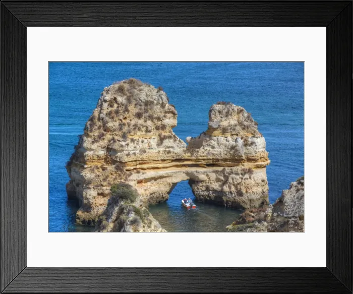 Framed Print : Tourist boat manoeuvering through the Grotos of Ponta da Piedade, Algarve, Portugal Framed Print : Tourist boat manoeuvering through the Grotos of Ponta da Piedade, Algarve, Portugal
