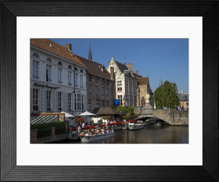 Framed Print : Tourists in boats travel on the Den Dijver canal in summer, Bruges, West Flanders