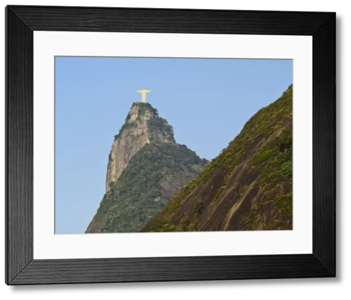 Framed Print : Christ the Redeemer statue on top of the Corcovado Mountain viewed from Santa Marta Framed Print : Christ the Redeemer statue on top of the Corcovado Mountain viewed from Santa Marta