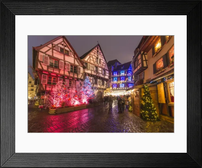 Framed Print : Typical houses enriched by Christmas ornaments and lights at dusk, Colmar, Haut-Rhin department Framed Print : Typical houses enriched by Christmas ornaments and lights at dusk, Colmar, Haut-Rhin department