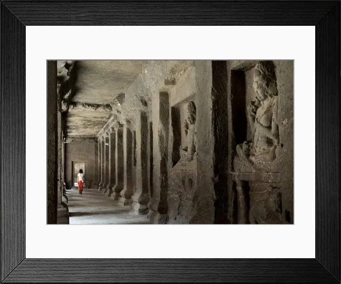 Framed Print : A woman walking through a corridor in the Hindu temple in the Kailash (Kailaszanatha)
