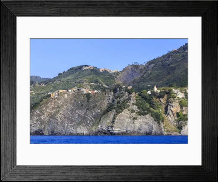 Framed Print : Colourful houses and cliffs atop rocky promontory, Corniglia, Cinque Terre, UNESCO Framed Print : Colourful houses and cliffs atop rocky promontory, Corniglia, Cinque Terre, UNESCO