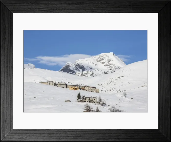 Framed Print : The snowy huts frame Peak Tambo in the background, Andossi, Spluga Valley, Province of Sondrio