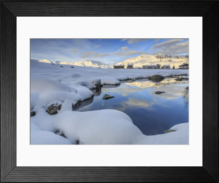 Framed Print : Mountain huts and reflections in Lago Azzurro surrounded by snow, Spluga Valley Framed Print : Mountain huts and reflections in Lago Azzurro surrounded by snow, Spluga Valley