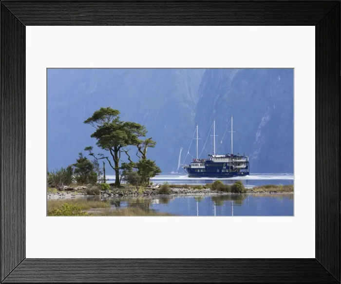 Framed Print : The Milford Mariner dwarfed by steep mountains, Milford Sound, Fiordland National Park Framed Print : The Milford Mariner dwarfed by steep mountains, Milford Sound, Fiordland National Park