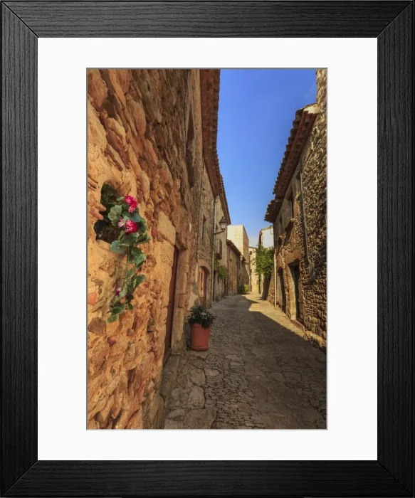 Framed Print : Gorgeous medieval village, cobblestone narrow lane and flowers, Peratallada, Baix Emporda Framed Print : Gorgeous medieval village, cobblestone narrow lane and flowers, Peratallada, Baix Emporda