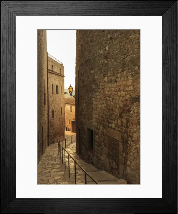 Framed Print : Steep and narrow winding street in gorgeous medieval hilltop walled village, Pals Framed Print : Steep and narrow winding street in gorgeous medieval hilltop walled village, Pals