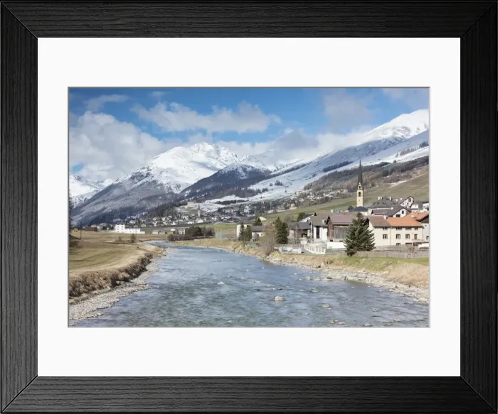 Framed Print : River Inn frames the alpine village of Zuoz surrounded by snowy peaks, Maloja, Canton of Graubunden Framed Print : River Inn frames the alpine village of Zuoz surrounded by snowy peaks, Maloja, Canton of Graubunden