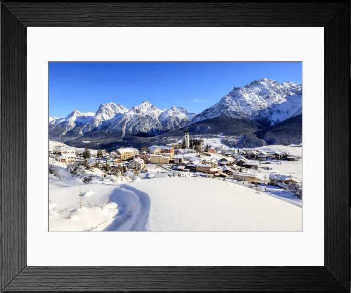 Framed Print : Blue sky on the alpine village of Ftan surrounded by snow, Inn district, Canton of Graubunden Framed Print : Blue sky on the alpine village of Ftan surrounded by snow, Inn district, Canton of Graubunden