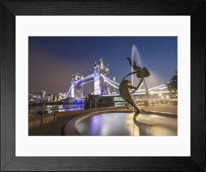 Framed Print : The Girl With A Dolphin Fountain frames Tower Bridge reflected in the River Thames at night Framed Print : The Girl With A Dolphin Fountain frames Tower Bridge reflected in the River Thames at night