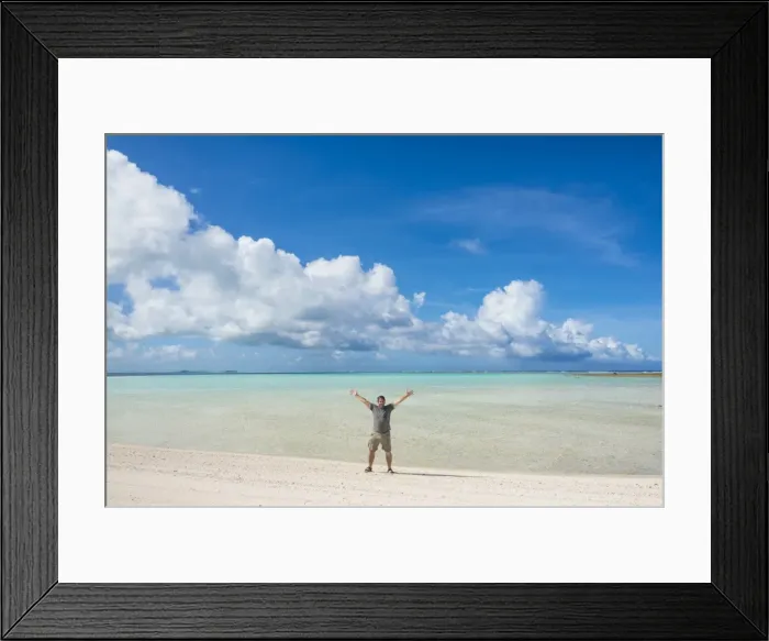 Framed Print : Man standing on a white sand beach in the lagoon of Wallis, Wallis and Futuna, Pacific Framed Print : Man standing on a white sand beach in the lagoon of Wallis, Wallis and Futuna, Pacific