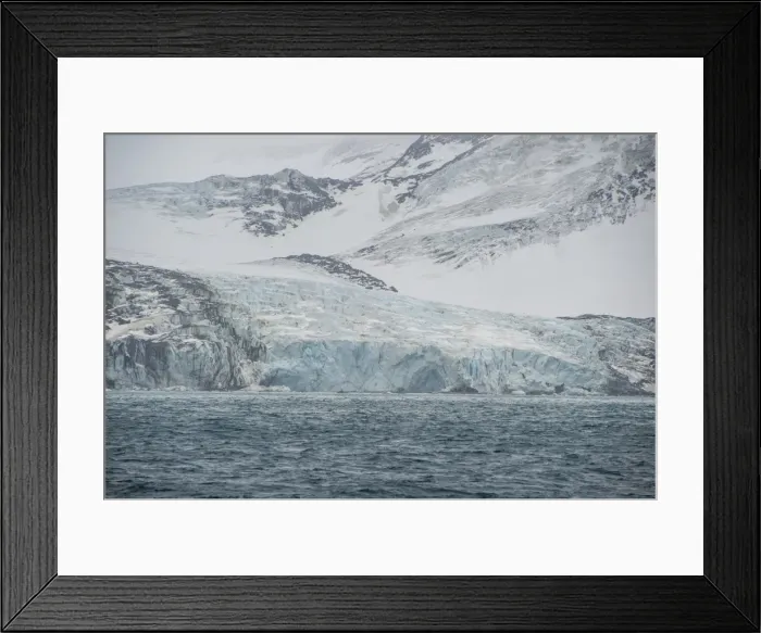 Framed Print : Glacier flowing down a mountain on Elephant Island, South Shetland Islands, Antarctica Framed Print : Glacier flowing down a mountain on Elephant Island, South Shetland Islands, Antarctica