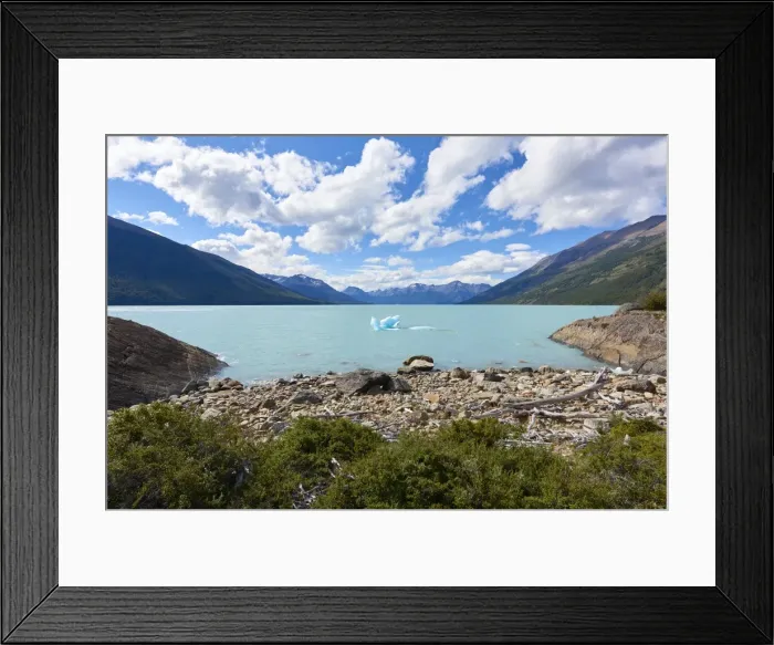 Framed Print : A single iceberg floating near the shore in Lago Argentino near Perito Moreno Glacier Framed Print : A single iceberg floating near the shore in Lago Argentino near Perito Moreno Glacier
