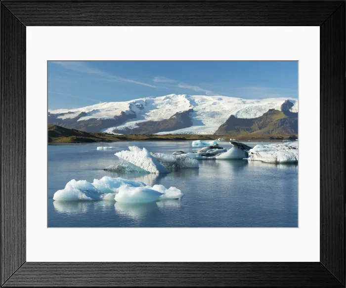 Framed Print : Icebergs floating on Jokulsarlon Glacial Lagoon with Hvannadalshnukur Peak in the background Framed Print : Icebergs floating on Jokulsarlon Glacial Lagoon with Hvannadalshnukur Peak in the background