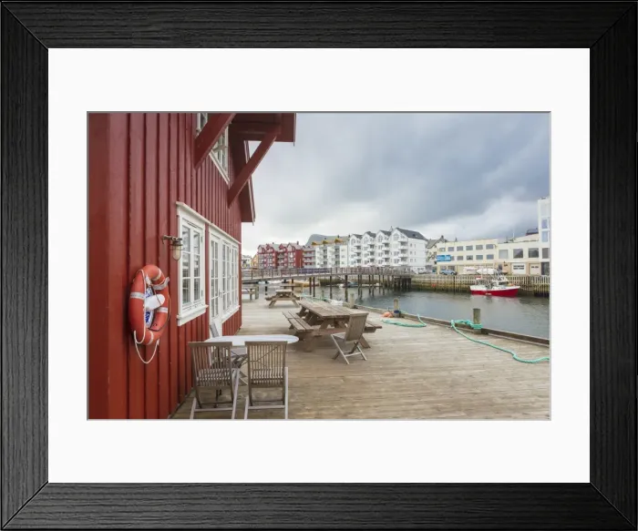 Framed Print : Clouds frame the typical wooden houses of the fishing village surrounded by sea, Svolvaer Framed Print : Clouds frame the typical wooden houses of the fishing village surrounded by sea, Svolvaer