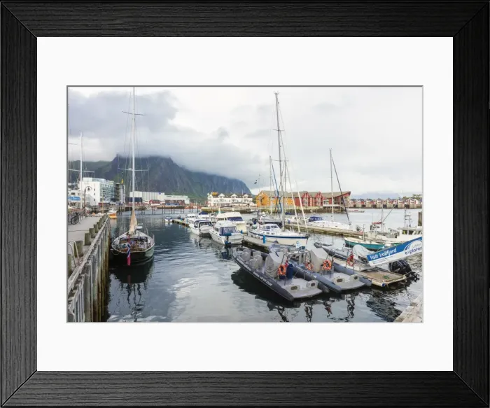 Framed Print : Clouds on rocky peaks frame the boats in the harbor of the fishing village of Svolvaer Framed Print : Clouds on rocky peaks frame the boats in the harbor of the fishing village of Svolvaer