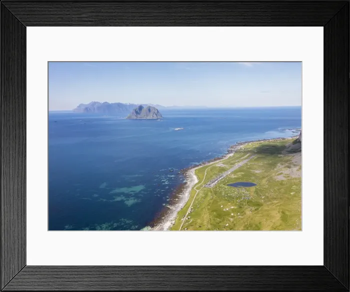 Framed Print : Tents in the green meadows surrounded by blue lake and sea, Vaeroy Island, Nordland county Framed Print : Tents in the green meadows surrounded by blue lake and sea, Vaeroy Island, Nordland county