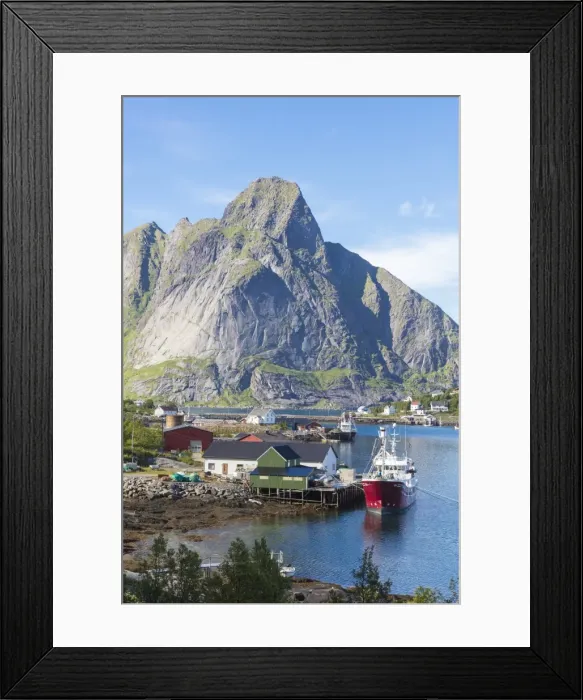 Framed Print : Ship in the blue sea frames the fishing village and the rocky peaks, Reine, Moskenesoya Framed Print : Ship in the blue sea frames the fishing village and the rocky peaks, Reine, Moskenesoya