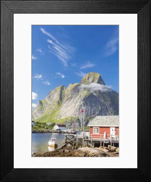 Framed Print : Typical house of fishermen called Rorbu framed by rocky peaks and blue sea, Reine Framed Print : Typical house of fishermen called Rorbu framed by rocky peaks and blue sea, Reine