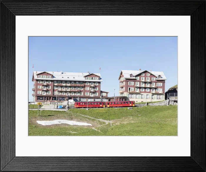Framed Print : Red wagons of Wengernalpbahn rack railway run next to alpine hotels, Wengen, Bernese Oberland Framed Print : Red wagons of Wengernalpbahn rack railway run next to alpine hotels, Wengen, Bernese Oberland