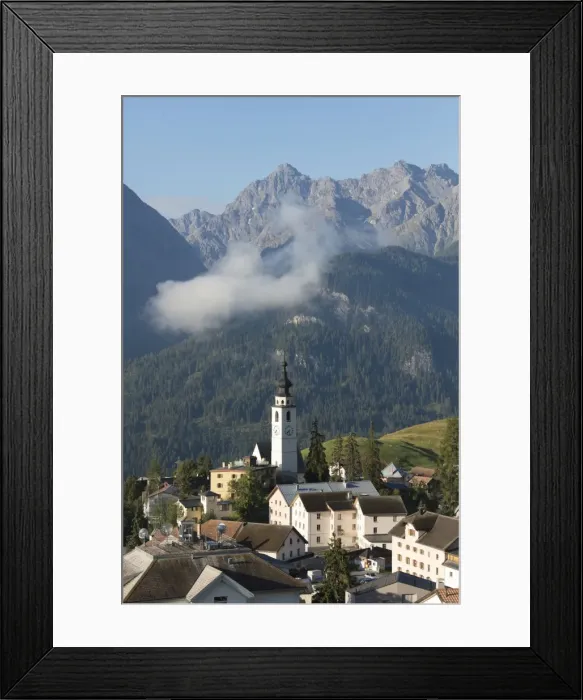 Framed Print : Blue sky on the alpine village of Ftan surrounded by rocky peaks, Inn district, Canton Framed Print : Blue sky on the alpine village of Ftan surrounded by rocky peaks, Inn district, Canton
