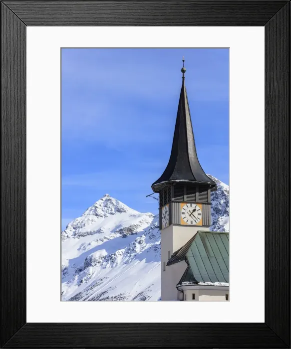 Framed Print : The typical alpine bell tower frames the snowy peaks, Langwies, district of Plessur Framed Print : The typical alpine bell tower frames the snowy peaks, Langwies, district of Plessur