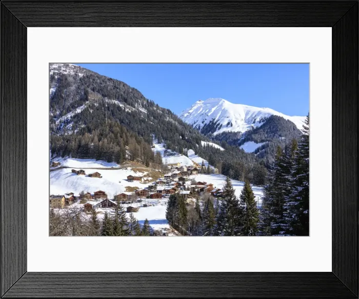 Framed Print : The alpine village of Langwies framed by woods and snowy peaks, district of Plessur Framed Print : The alpine village of Langwies framed by woods and snowy peaks, district of Plessur
