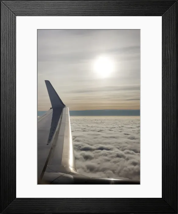 Framed Print : Plane wing with low lying clouds and sunburst, United Kingdom, Europe Framed Print : Plane wing with low lying clouds and sunburst, United Kingdom, Europe