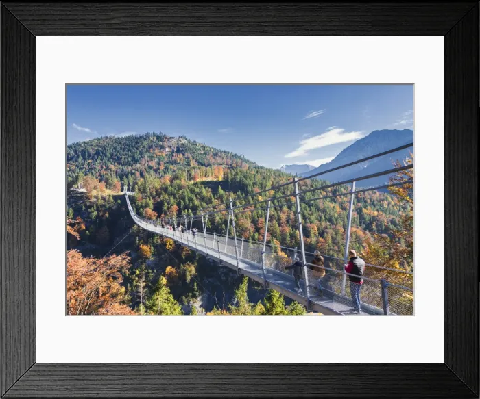 Framed Print : Tourists on the suspension bridge called Highline 179 framed by colorful woods in autumn Framed Print : Tourists on the suspension bridge called Highline 179 framed by colorful woods in autumn