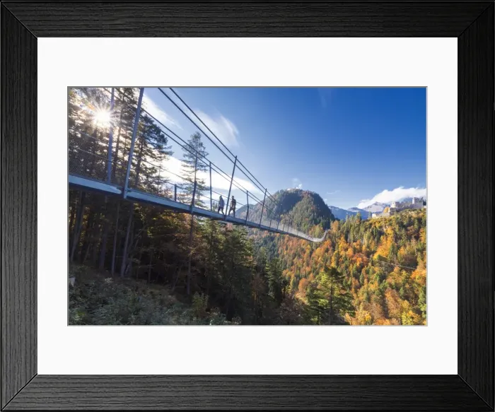 Framed Print : Tourists on the suspension bridge called Highline 179 framed by colorful woods in autumn Framed Print : Tourists on the suspension bridge called Highline 179 framed by colorful woods in autumn
