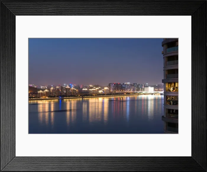 Framed Print : Beautifully illuminated high rises on Qiantang River in Hangzhou, Zhejiang province Framed Print : Beautifully illuminated high rises on Qiantang River in Hangzhou, Zhejiang province