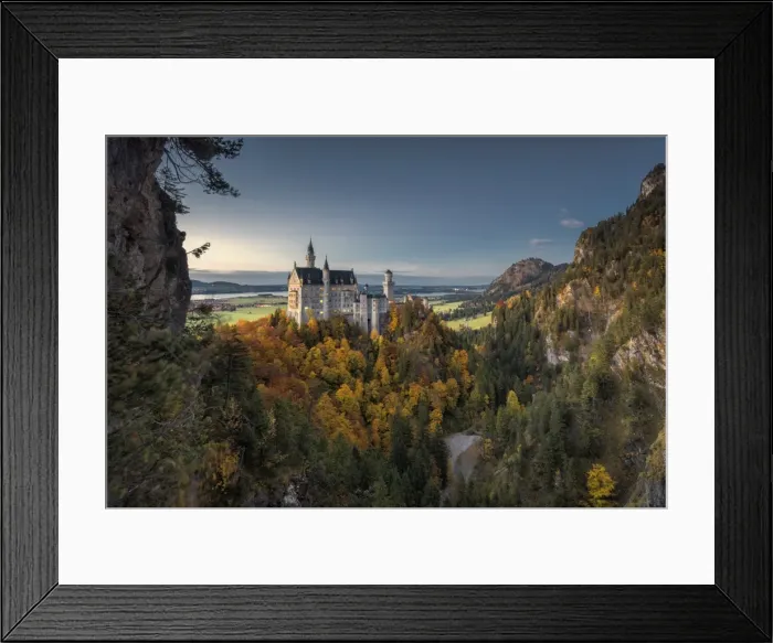 Framed Print : Dusk lights on Neuschwanstein Castle surrounded by colorful woods in autumn, Fussen Framed Print : Dusk lights on Neuschwanstein Castle surrounded by colorful woods in autumn, Fussen