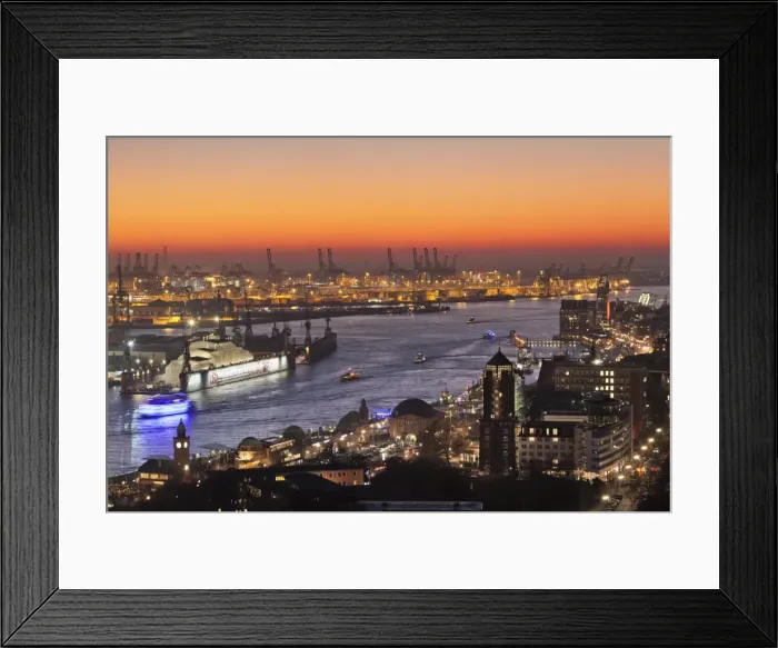 Framed Print : View over St. Pauli district and St. Pauli Landungsbruecken pier over the harbour at sunset Framed Print : View over St. Pauli district and St. Pauli Landungsbruecken pier over the harbour at sunset