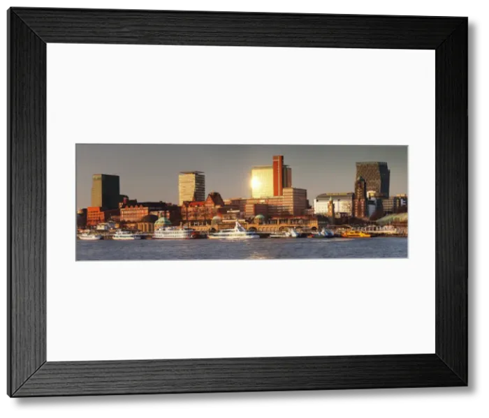 Framed Print : View from Elbe River to St. Pauli Landungsbruecken pier and skyscraper Tanzende Tuerme at sunset