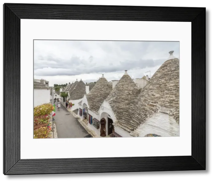 Framed Print : The typical huts called Trulli built with dry stone with a conical roof, Alberobello Framed Print : The typical huts called Trulli built with dry stone with a conical roof, Alberobello