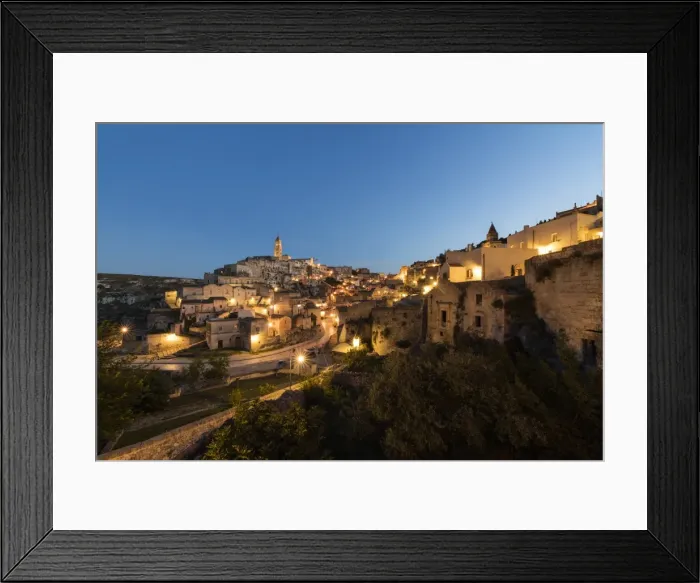 Framed Print : Dusk on the ancient town and historical center called Sassi, perched on rocks on top of hill Framed Print : Dusk on the ancient town and historical center called Sassi, perched on rocks on top of hill