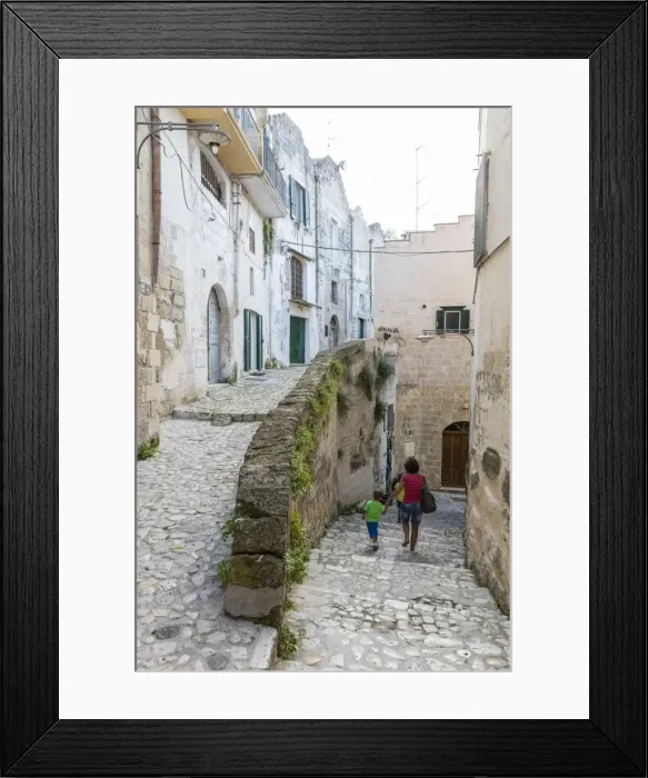 Framed Print : Typical stone alleys in the old town center of Matera also known as the Subterranean City Framed Print : Typical stone alleys in the old town center of Matera also known as the Subterranean City