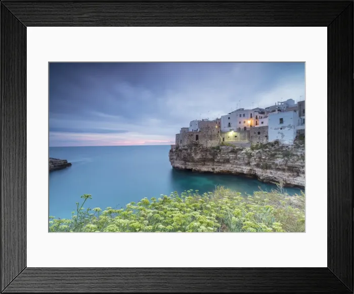 Framed Print : Turquoise sea at sunrise framed by the old town perched on the rocks, Polignano a Mare Framed Print : Turquoise sea at sunrise framed by the old town perched on the rocks, Polignano a Mare