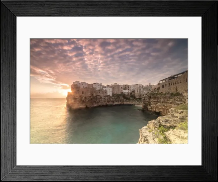 Framed Print : Pink sunrise on the turquoise sea framed by old town perched on the rocks, Polignano a Mare Framed Print : Pink sunrise on the turquoise sea framed by old town perched on the rocks, Polignano a Mare