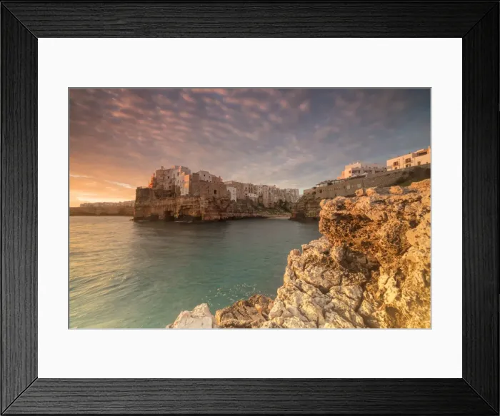 Framed Print : Pink sunrise on the turquoise sea framed by old town perched on the rocks, Polignano a Mare Framed Print : Pink sunrise on the turquoise sea framed by old town perched on the rocks, Polignano a Mare