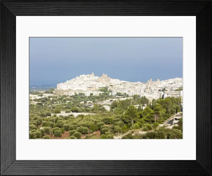 Framed Print : View of typical architecture and white houses of the old medieval town, Ostuni, Province Framed Print : View of typical architecture and white houses of the old medieval town, Ostuni, Province